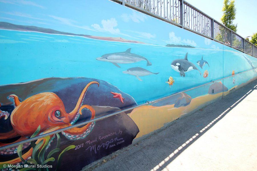 California Avenue Underpass Mural in Palo Alto with Sunny Ocean Scene and Bright Orange Octopus