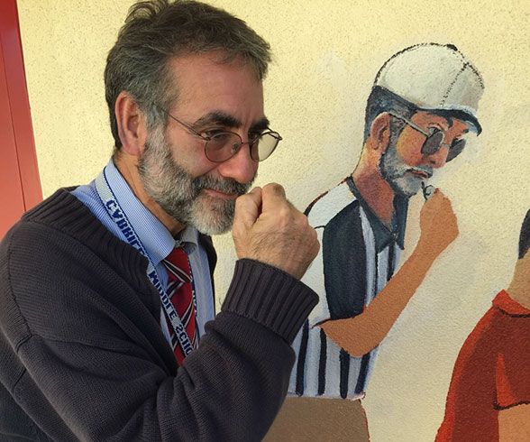 Cabrillo Middle School Principal Stan Garber showcases the accuracy of the mural.