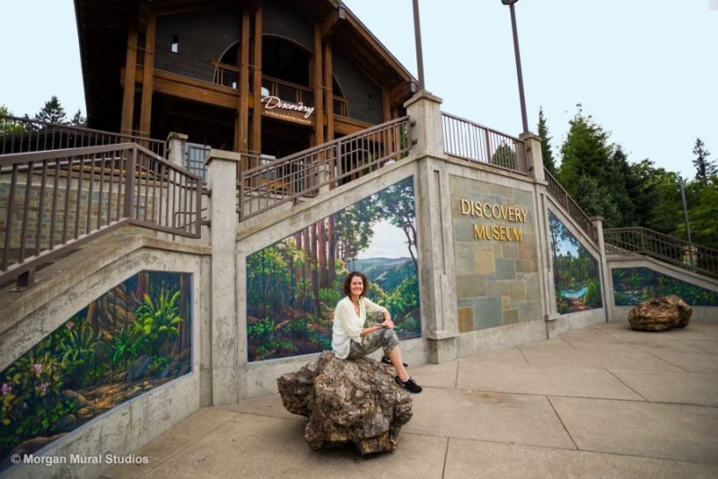 Muralist Morgan Bricca with the World Forestry Center Discovery Museum Mural