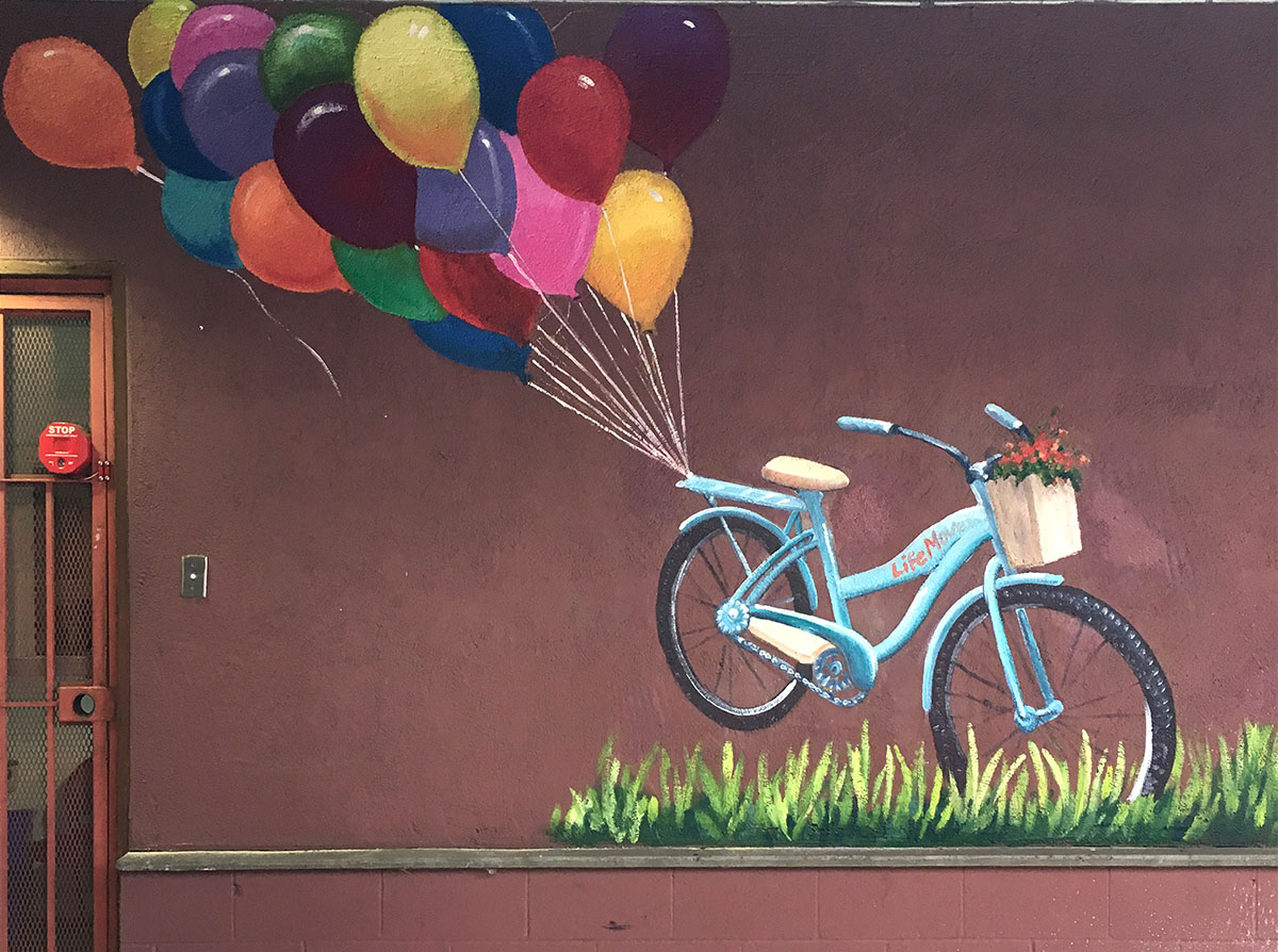 Colorful Balloon Mural with Teal Bicycle