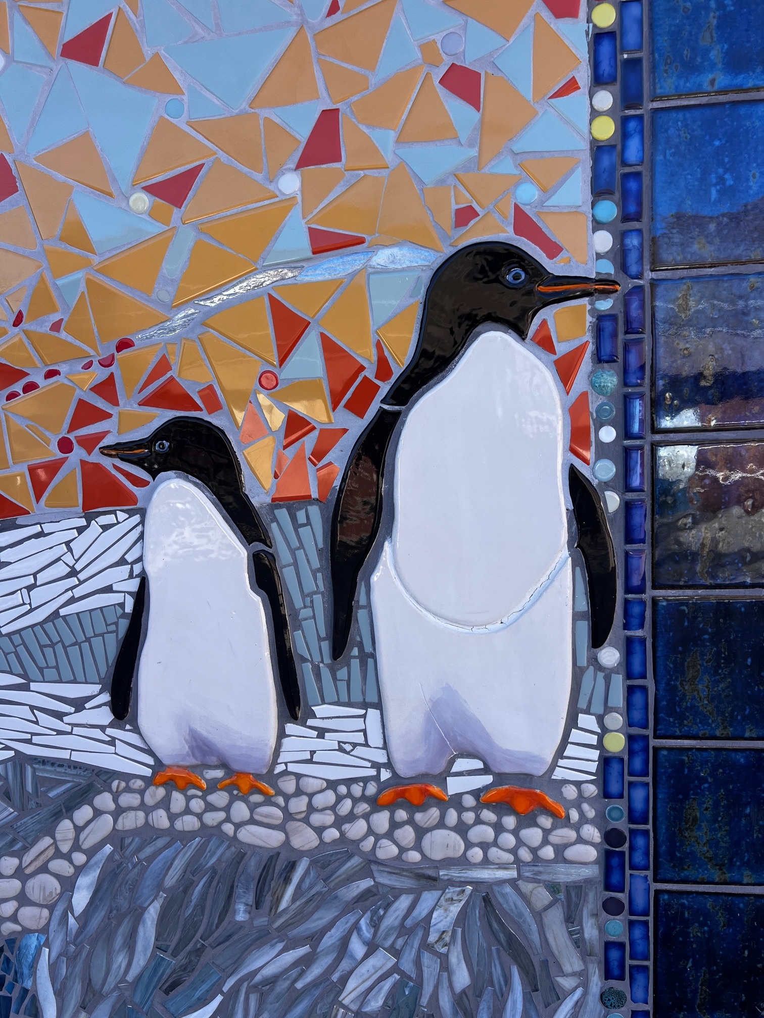 Mosaic of penguins at elementary school