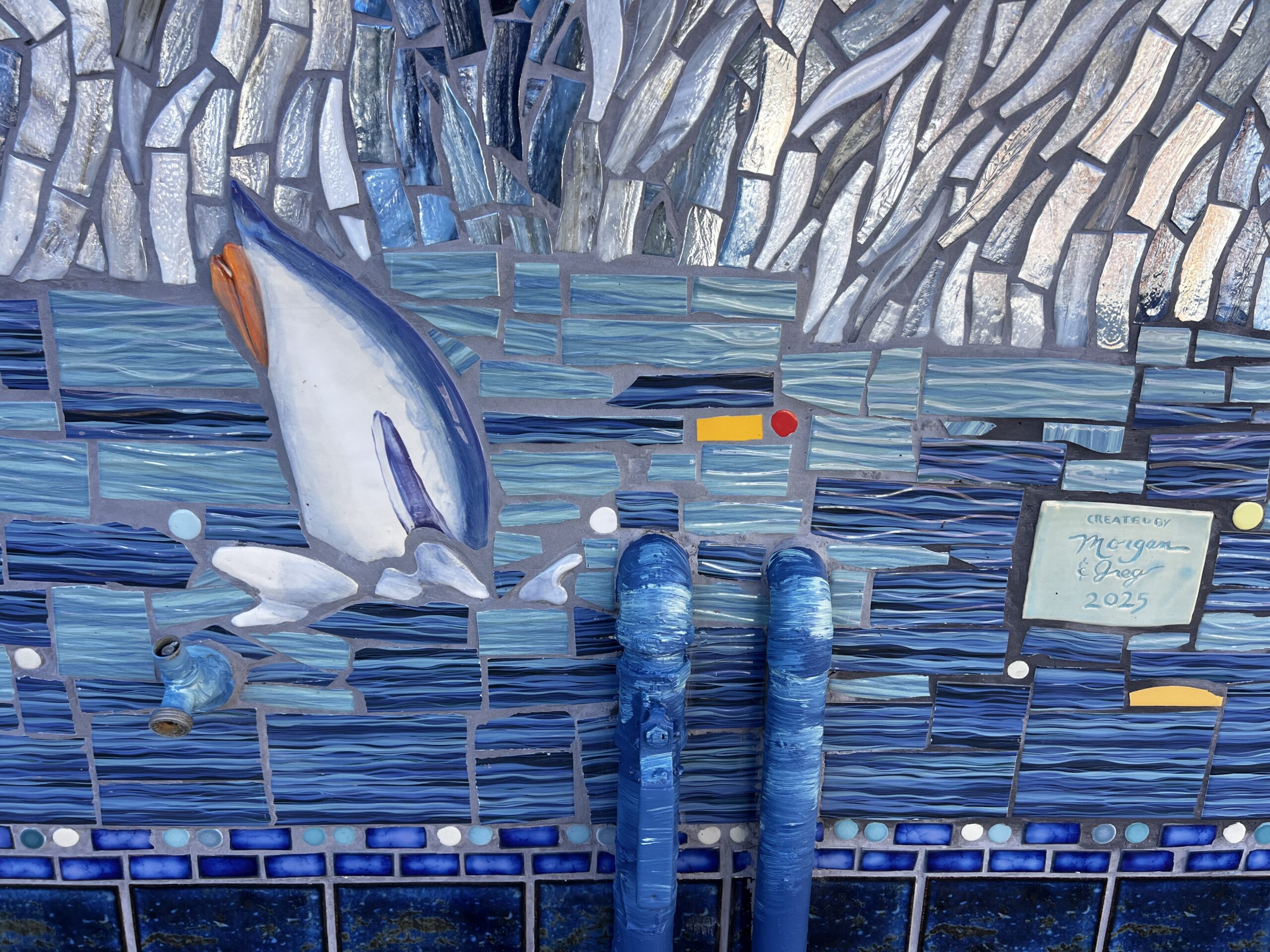 Mosaic of penguins at elementary school
