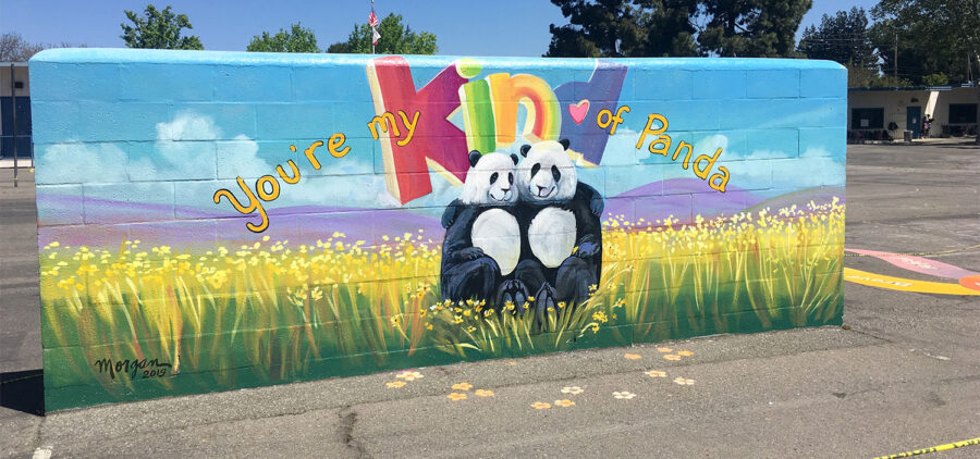 Hired to paint flowers and pandas... being a school muralist is so much fun!
