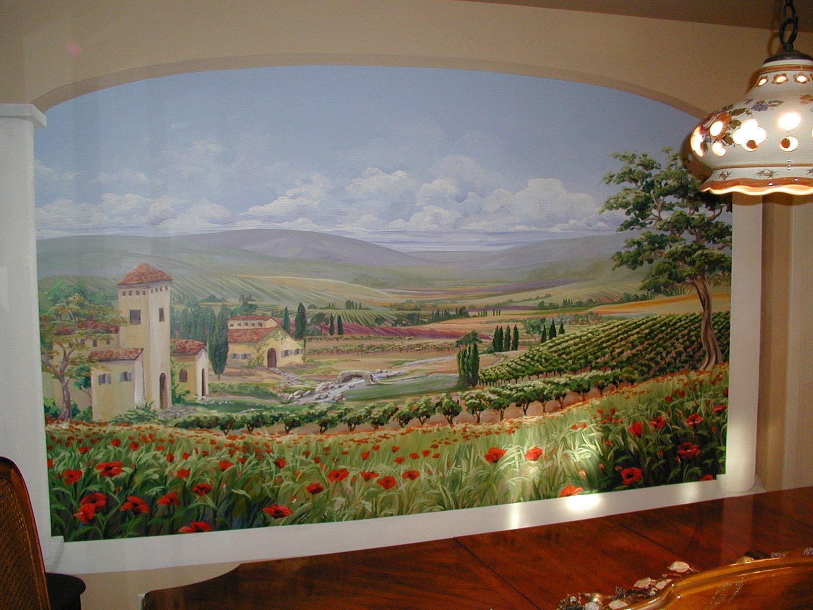 House Mural with Green Vineyards, Red Flowers, and Rolling Hills